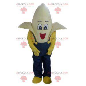 Mascote gigante banana vestido com macacão azul - Redbrokoly.com