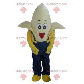 Mascote gigante banana vestido com macacão azul - Redbrokoly.com