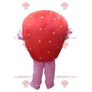 Mascote gigante de morango vermelho e rosa sorrindo -