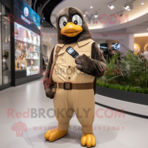 Tan Penguin mascot costume character dressed with a Jumpsuit and Smartwatches