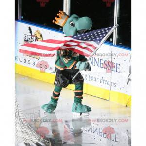Green turtle mascot with a crown and a hockey outfit -