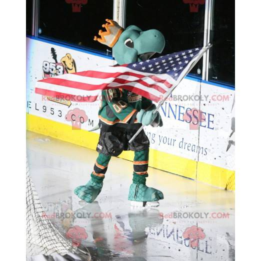 Mascotte groene schildpad met een kroon en een hockey-outfit -