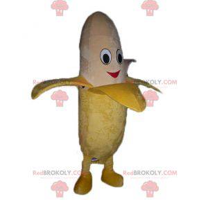 Obří žluté a béžové banán maskot s úsměvem - Redbrokoly.com