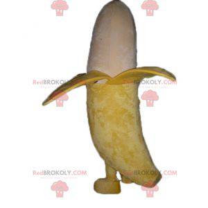 Mascotte de banane géante jaune et beige souriante -