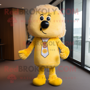 Yellow Shepard'S Pie mascot costume character dressed with a Suit Pants and Brooches