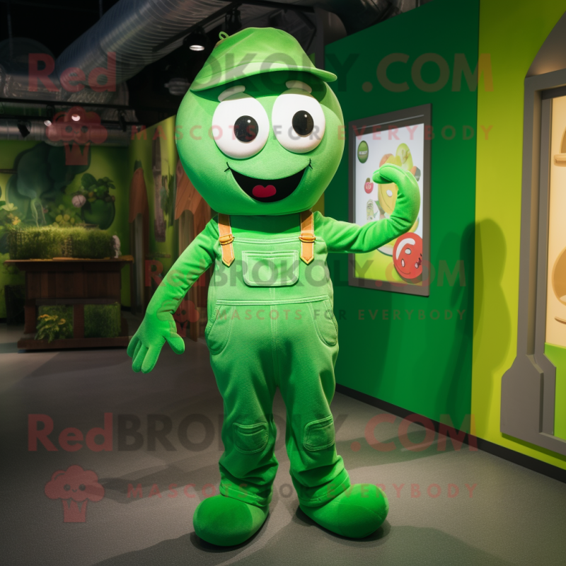 Green Pho mascot costume character dressed with a Dungarees and Shoe laces Green Pho mascot costume character dressed with a Dungarees and Shoe laces