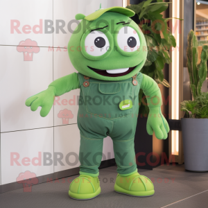 Green Pho mascot costume character dressed with a Dungarees and Shoe laces