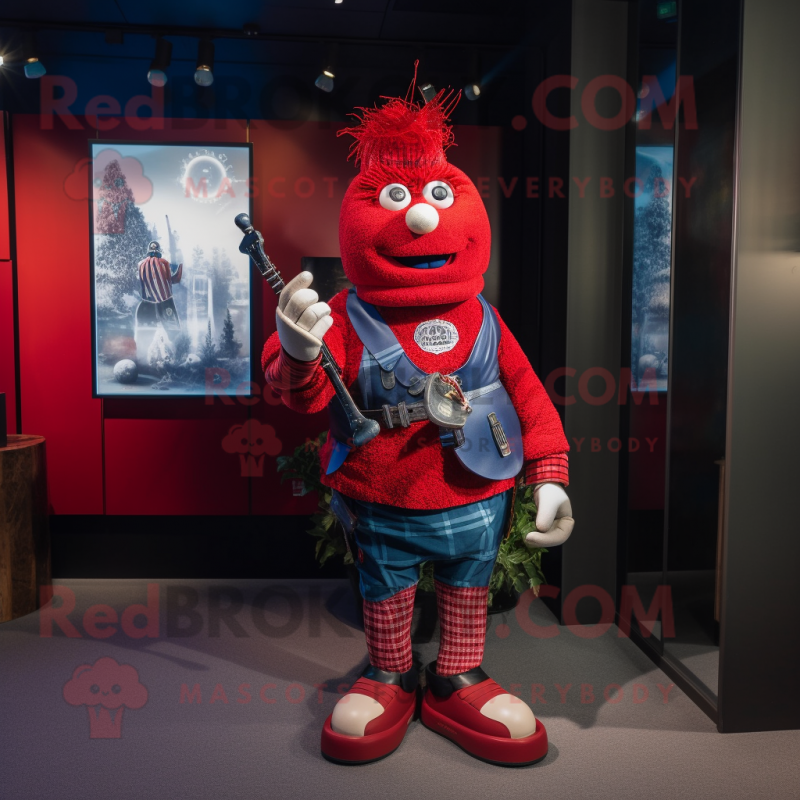 Red Bagpipe mascot costume character dressed with a Boyfriend Jeans and Brooches Red Bagpipe mascot costume character dressed with a Boyfriend Jeans and Brooches