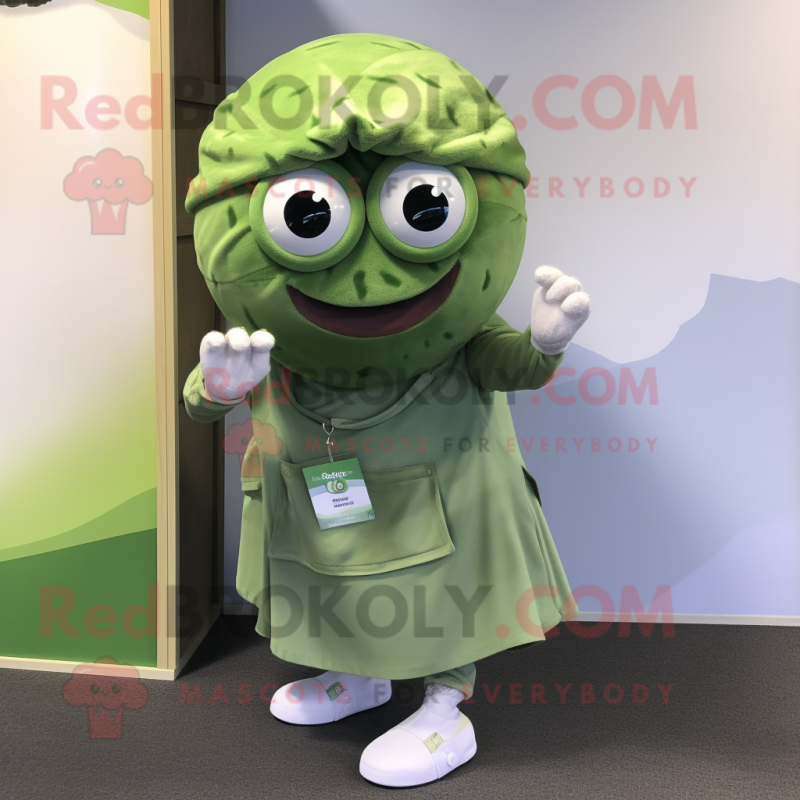 Olive Golf Ball mascot costume character dressed with a Mini Dress and Scarf clips