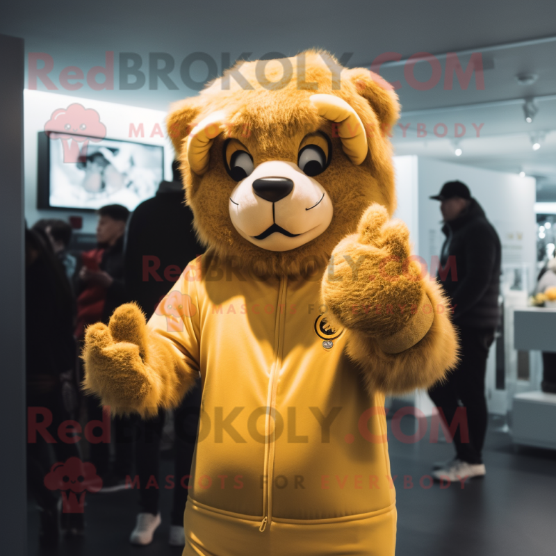 Gold Tamer Lion mascot costume character dressed with a Hoodie and Mittens Gold Tamer Lion mascot costume character dressed with a Hoodie and Mittens