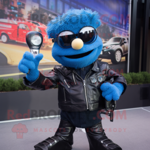 Blue Camera mascot costume character dressed with a Biker Jacket and Shoe clips