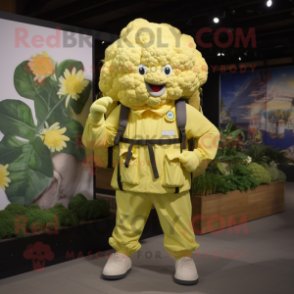 Lemon Yellow Cauliflower mascot costume character dressed with a Cargo Pants and Backpacks