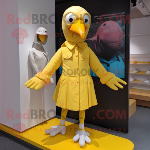 Yellow Albatross mascot costume character dressed with a Mini Skirt and Gloves