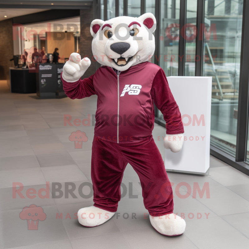 Maroon Puma mascot costume character dressed with a Jacket and Clutch bags