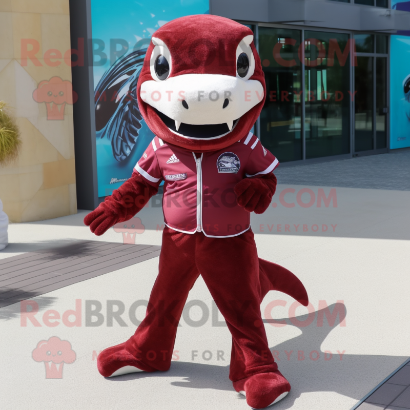 Maroon Dolphin mascot costume character dressed with a Skinny Jeans and Foot pads