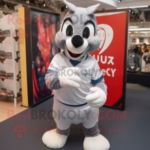 Silver Quail mascot costume character dressed with a Rugby Shirt and Gloves