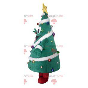 Mascotte dell'albero di Natale decorato con un ampio sorriso -