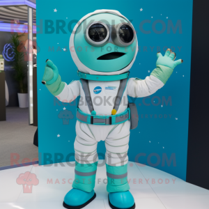 Turquoise Astronaut mascot costume character dressed with a Waistcoat and Eyeglasses