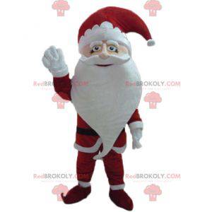 Mascotte di Babbo Natale vestito in abiti tradizionali -