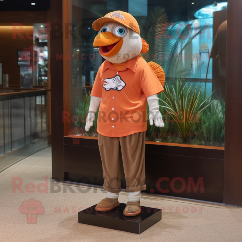 Brown Clown Fish mascot costume character dressed with a Polo Tee and Hat pins Brown Clown Fish mascot costume character dressed with a Polo Tee and Hat pins
