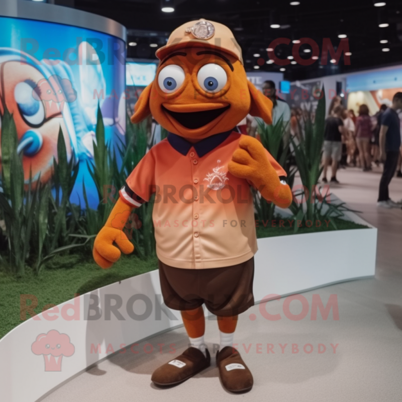 Brown Clown Fish mascot costume character dressed with a Polo Tee and Hat pins