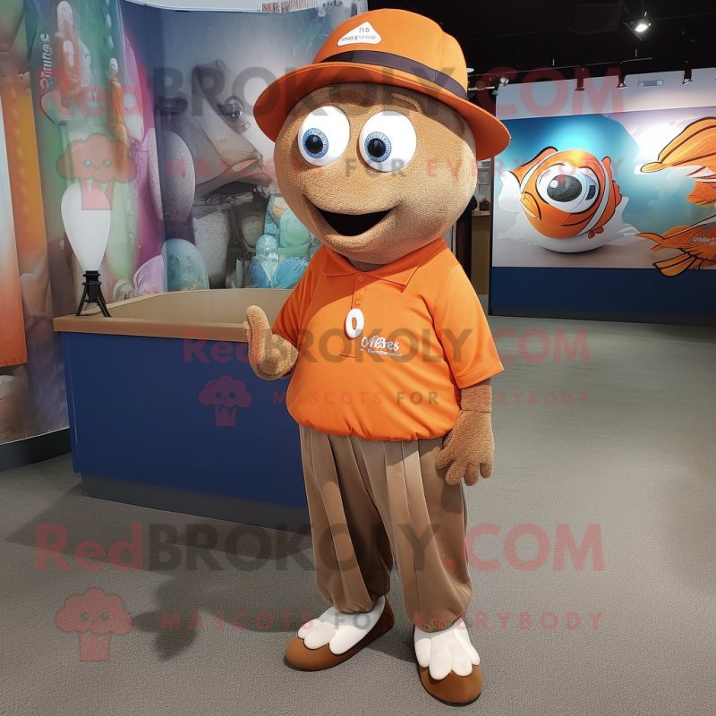 Brown Clown Fish mascot costume character dressed with a Polo Tee and Hat pins Brown Clown Fish mascot costume character dressed with a Polo Tee and Hat pins