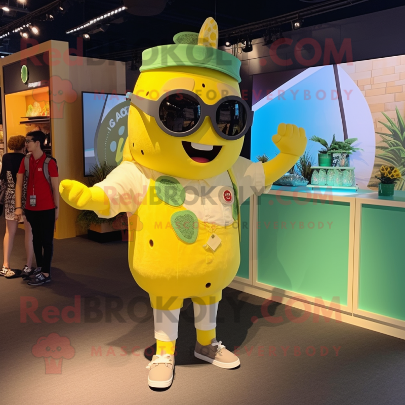 Lemon Yellow Goulash mascot costume character dressed with a Romper and Sunglasses Lemon Yellow Goulash mascot costume character dressed with a Romper and Sunglasses