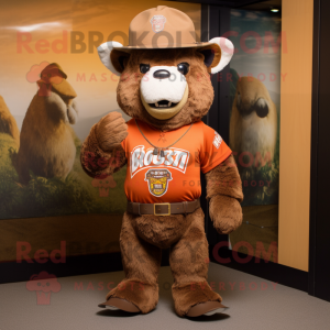 Rust Bison mascot costume character dressed with a Rash Guard and Hat pins
