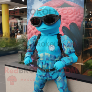 Turquoise Marine Recon mascot costume character dressed with a Swimwear and Bracelets