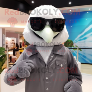 Gray Albatross mascot costume character dressed with a Vest and Sunglasses