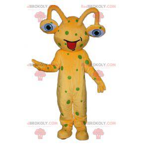 Yellow alien mascot with green peas - Redbrokoly.com