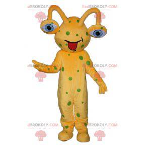 Yellow alien mascot with green peas - Redbrokoly.com