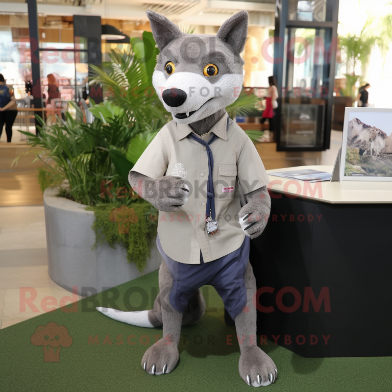 Gray Thylacosmilus mascot costume character dressed with a Oxford Shirt and Keychains Gray Thylacosmilus mascot costume character dressed with a Oxford Shirt and Keychains
