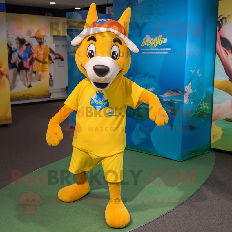 Yellow Dingo mascot costume character dressed with a Capri Pants and Headbands