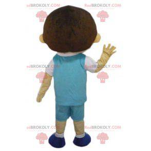 Mascotte de garçon d'écolier bien habillé avec une tenue bleue