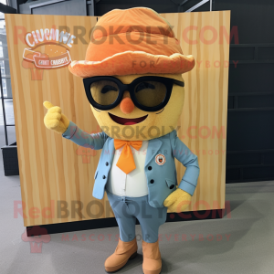 Orange Croissant mascot costume character dressed with a Chambray Shirt and Lapel pins