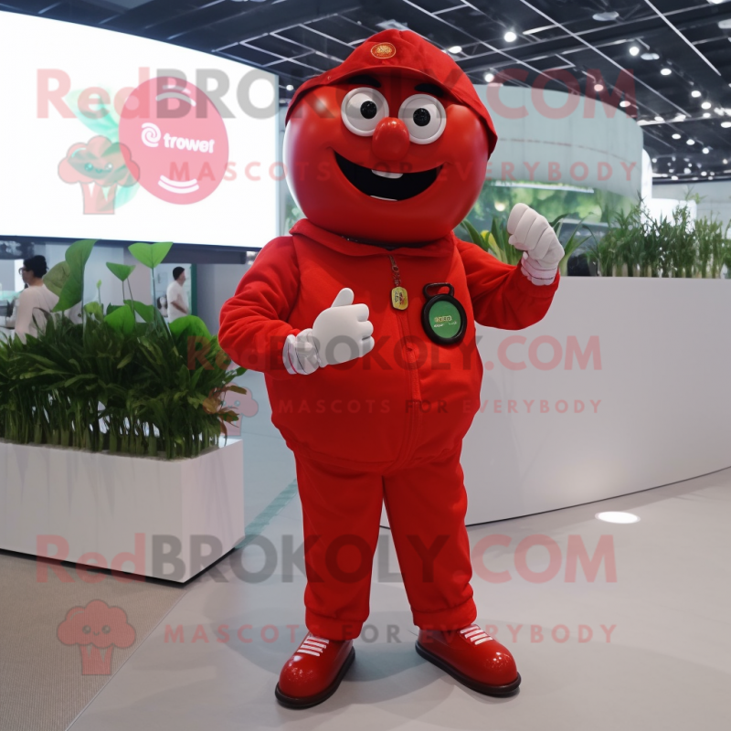 Red Tomato mascot costume character dressed with a Jumpsuit and Digital watches Red Tomato mascot costume character dressed with a Jumpsuit and Digital watches