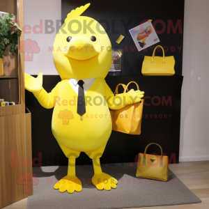 Lemon Yellow Dove mascot costume character dressed with a Suit and Tote bags