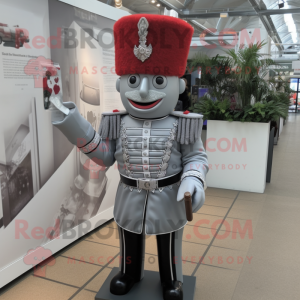 Silver British Royal Guard mascot costume character dressed with a Button-Up Shirt and Handbags