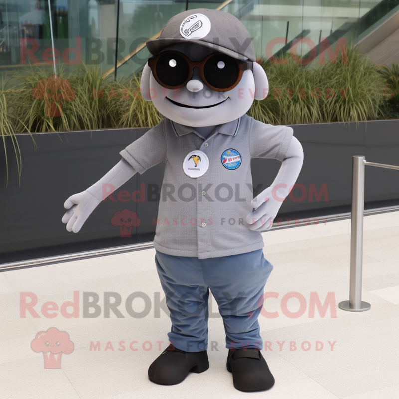 Gray Cyclops mascot costume character dressed with a Polo Shirt and Sunglasses Gray Cyclops mascot costume character dressed with a Polo Shirt and Sunglasses