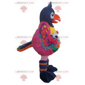 Mascotte de grand oiseau multicolore avec un ballon -