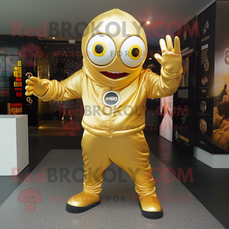 Gold Cyclops mascot costume character dressed with a Hoodie and Shoe clips Gold Cyclops mascot costume character dressed with a Hoodie and Shoe clips