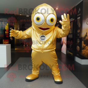 Gold Cyclops mascot costume character dressed with a Hoodie and Shoe clips