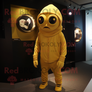 Gold Cyclops mascot costume character dressed with a Hoodie and Shoe clips