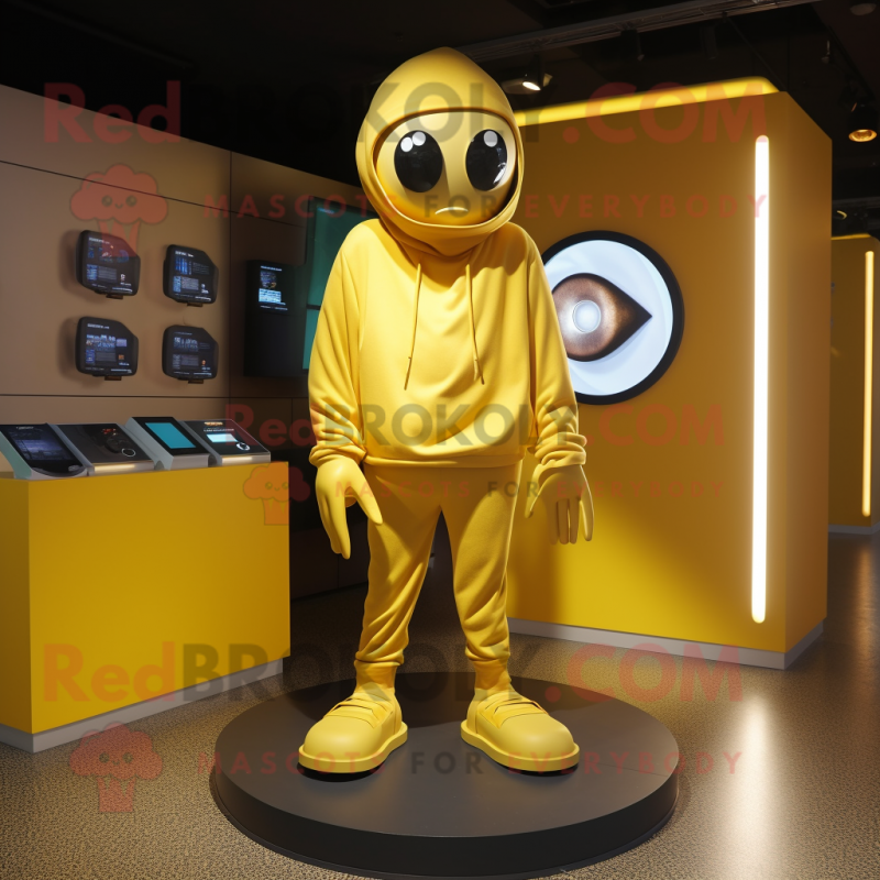 Gold Cyclops mascot costume character dressed with a Hoodie and Shoe clips