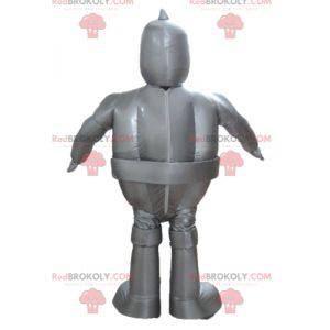 Mascotte robot grigio metallizzato gigante e sorridente -