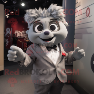 Gray But mascot costume character dressed with a Suit Jacket and Brooches
