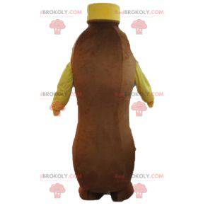 Mascotte bottiglia marrone e gialla di bevanda al cioccolato -