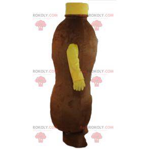 Mascote marrom e garrafa amarela de bebida de chocolate -
