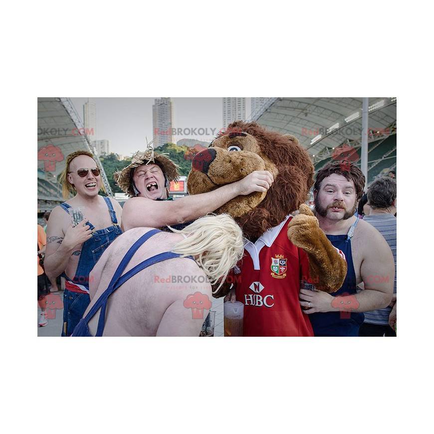 Brown lion mascot all hairy in red sportswear - Redbrokoly.com